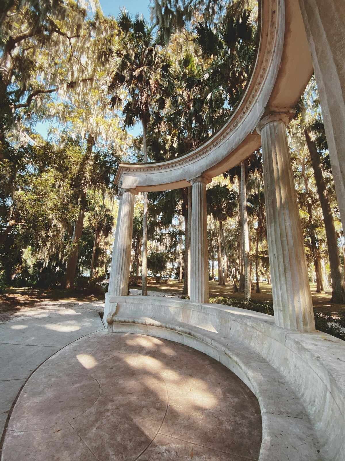 The stone monument and columns at Kraft Azalea Garden in Winter Park, a popular Orlando family photography location surrounded by Spanish moss and cypress trees