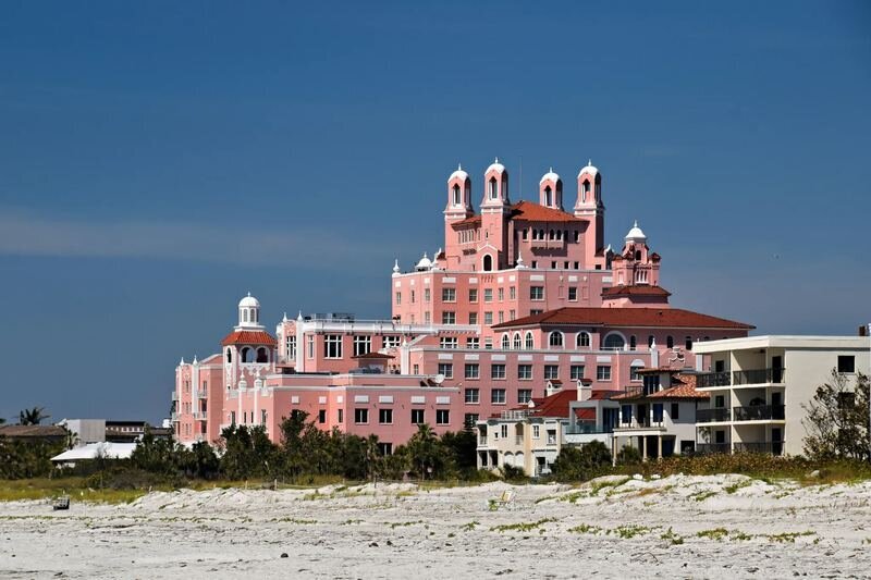The iconic pink Don CeSar hotel rising above the white sand shoreline at St. Pete Beach, Tampa — a beloved landmark backdrop for Tampa family photographer sessions by Dreamgraphy