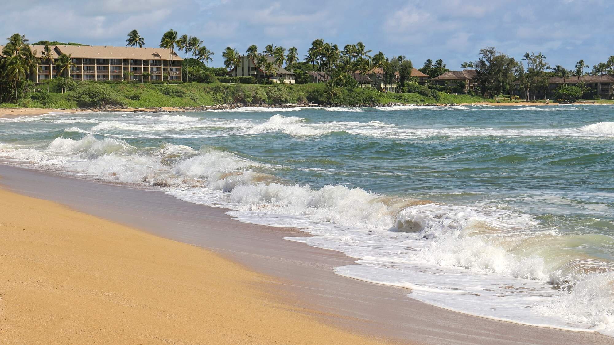 Wailua Beach on Kauai's East Side — Kapa'a Coconut Coast Wailua Beach on Kauai's East Side near Kapa'a, with palm trees, turquoise water, and golden sand