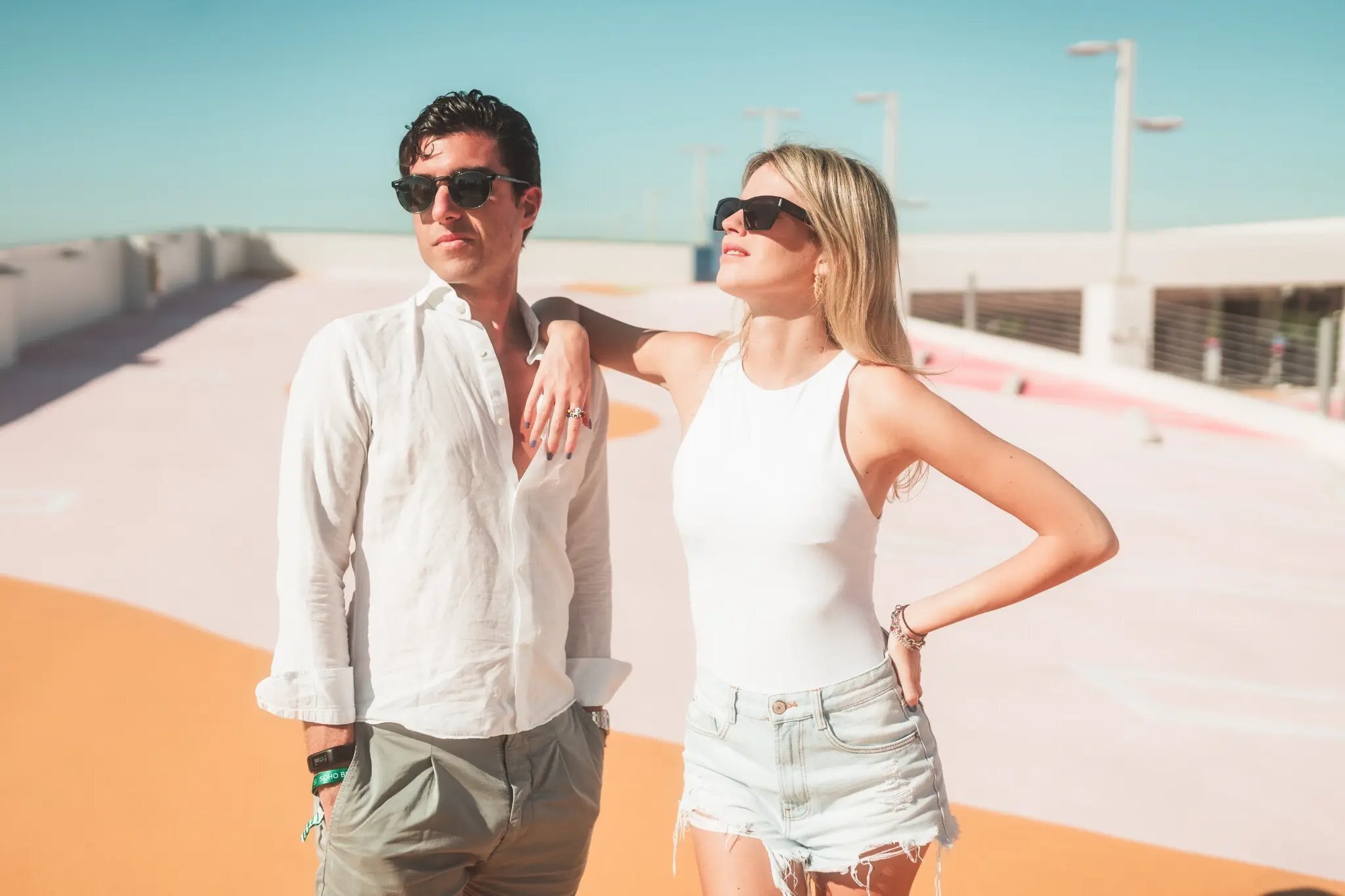 Couple Photoshoot in Miami Florida — South Beach Style Session A stylish couple standing together on a sun-drenched rooftop in Miami Florida during a vacation couple photoshoot