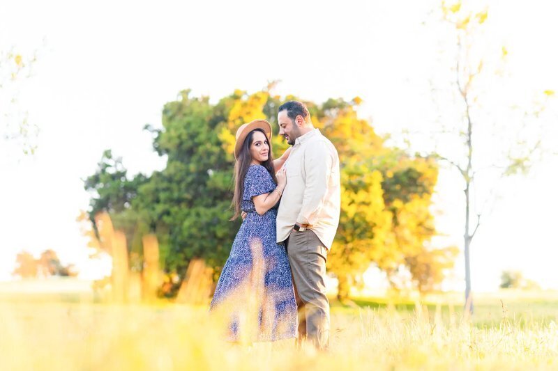 Couple Photoshoot in Los Angeles California — Golden Hour Field Session A couple embracing in a sunlit field during a romantic couple photography session in Los Angeles California