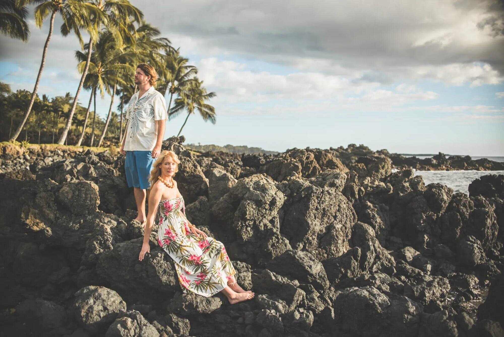 Couple Photoshoot in Maui Hawaii — Lava Rock Coastline Session A couple posing on a dramatic lava rock coastline in Maui Hawaii during a romantic couple photoshoot