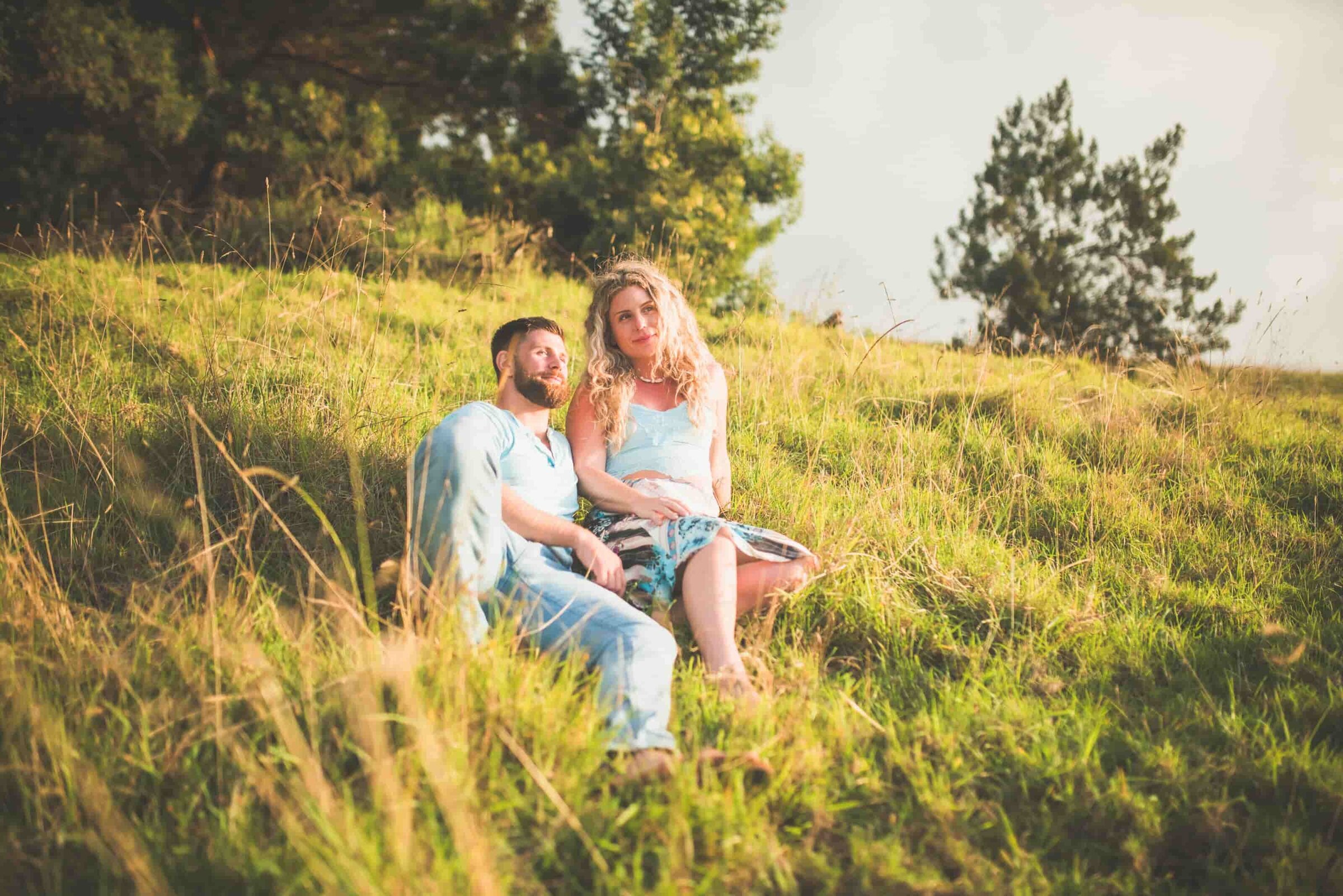 Couple in meadow Couple standing together in an Upcountry Maui meadow at golden hour