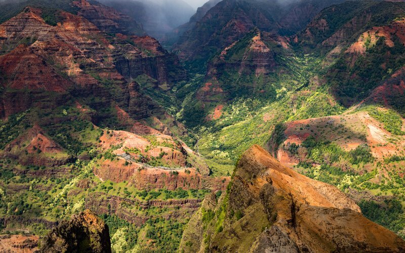 Waimea Canyon — The Grand Canyon of the Pacific, Kauai Waimea Canyon on Kauai, known as the Grand Canyon of the Pacific, with red rock cliffs and lush green valleys