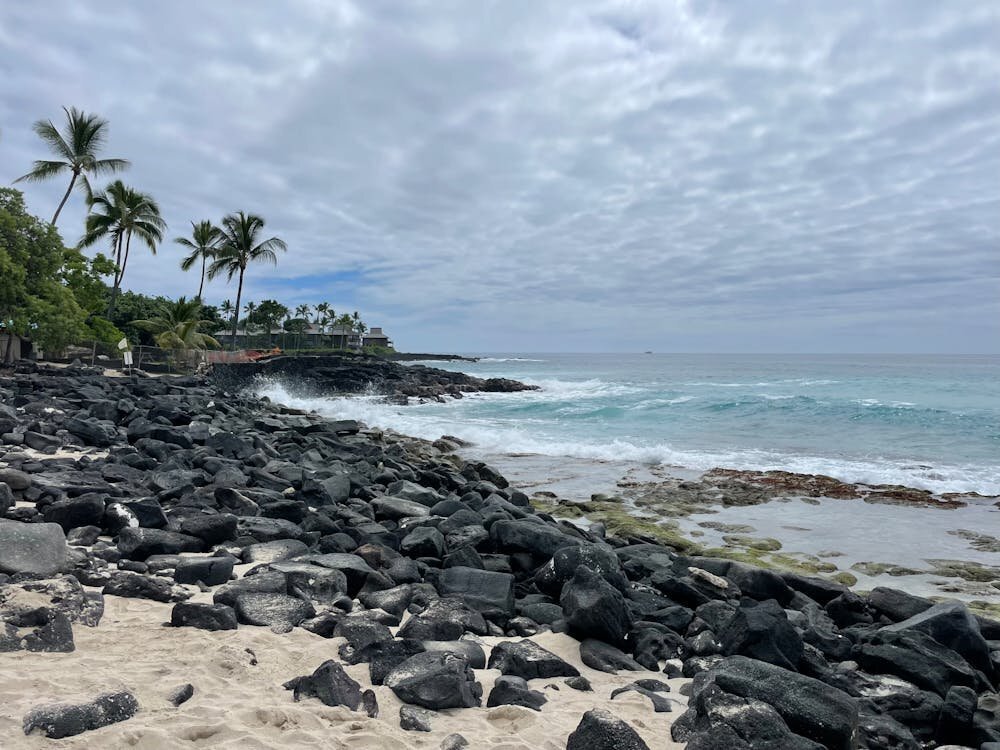 Photo Session Location — Kailua-Kona, Big Island Hawaii Rocky lava coastline and turquoise ocean at Kailua-Kona on the Big Island of Hawaii with palm trees in the background