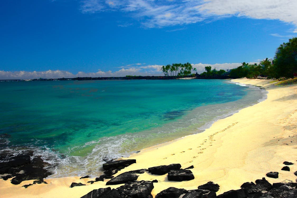 Photo Session Location — Kohala Coast, Big Island Hawaii Clear turquoise water and white sand beach with lava rocks along the Kohala Coast on the Big Island of Hawaii