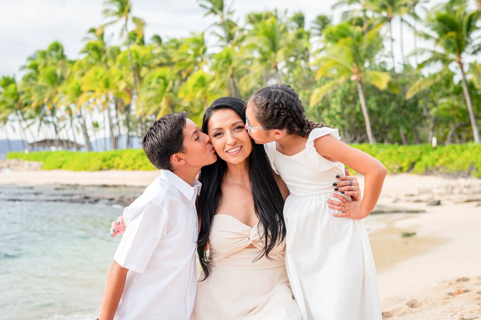 Parent and Child Candid Family Photography A mother hugging her young daughter during a candid vacation family photography session