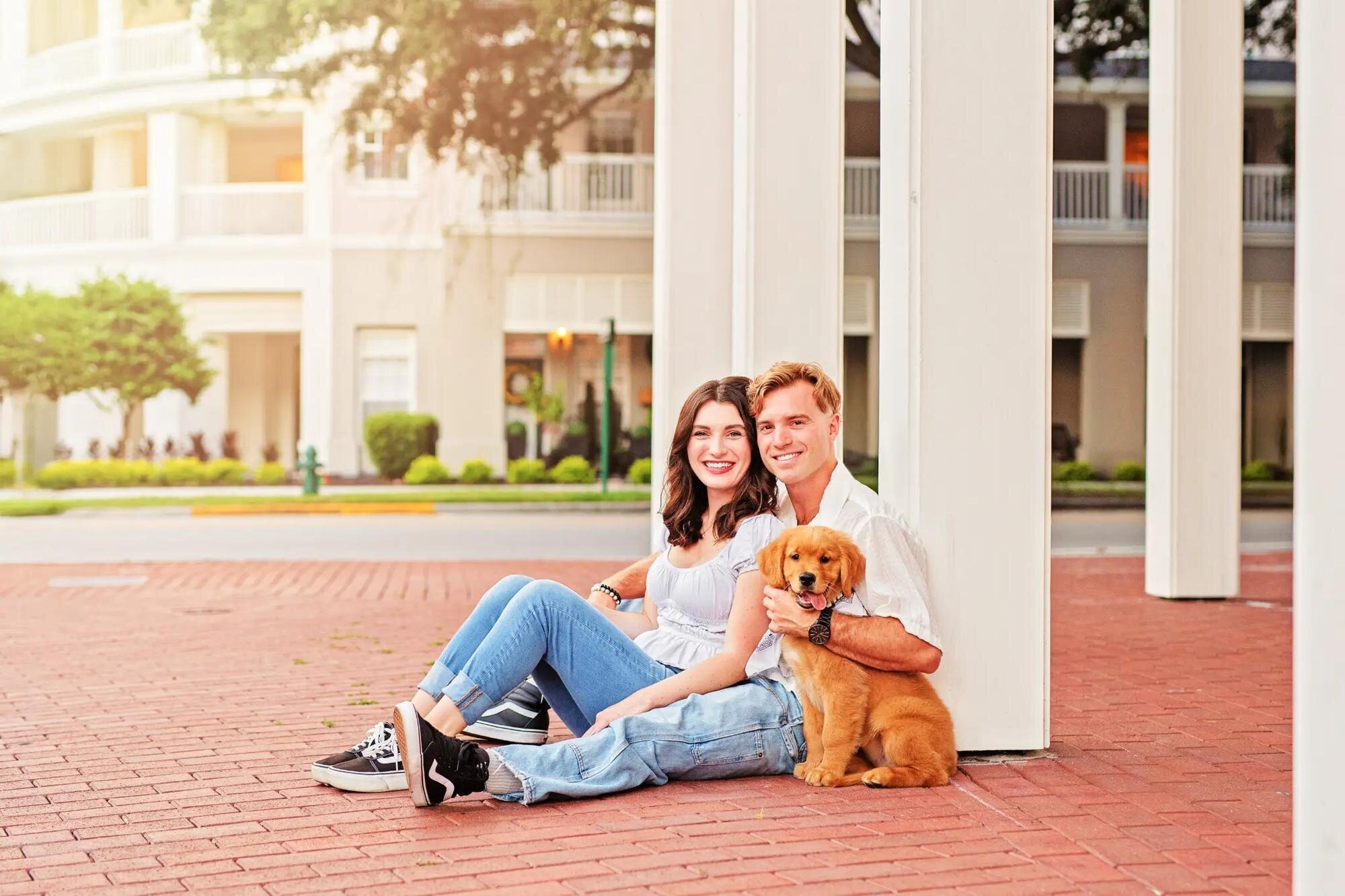 Couple with dog in downtown Tampa Couple walking with their dog during a downtown Tampa session