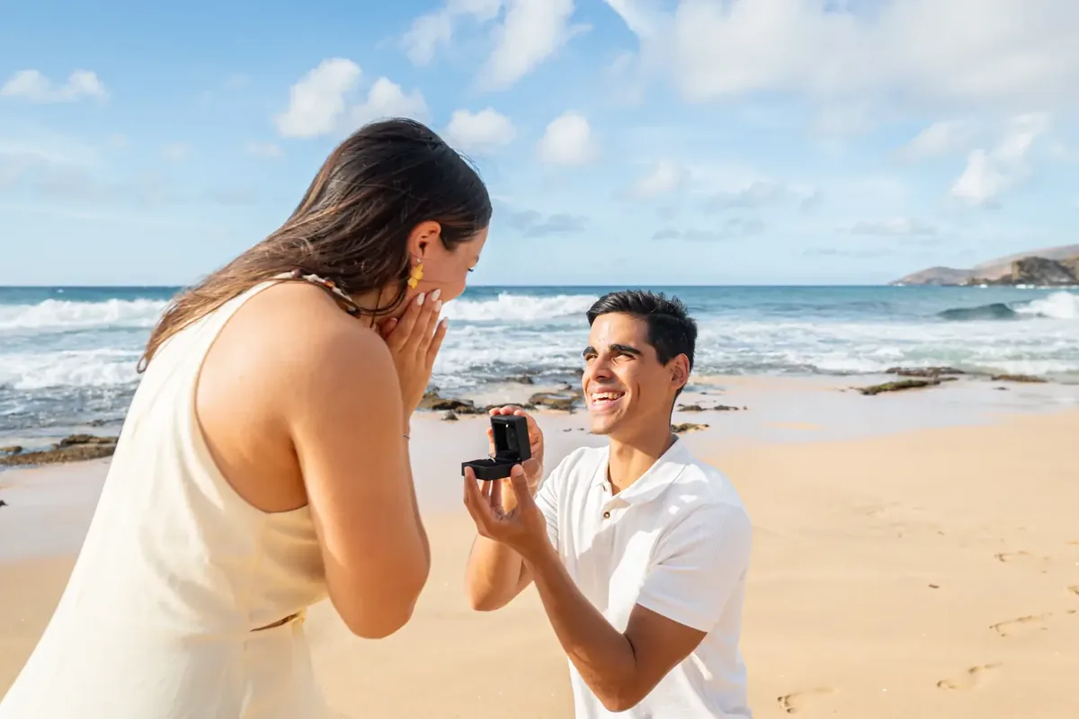 Couple getting engaged at Mākena Cove Maui, one of the best places to propose in Hawaii